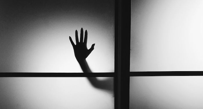 horror hand on window.jpg.optimal