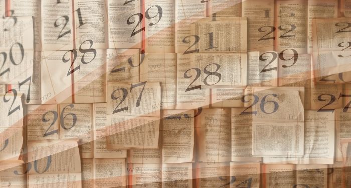 open books with semi transparent overlay of calendar pages.jpg.optimal